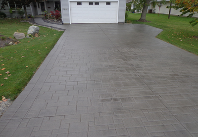 Paver style stamped concrete driveway.
