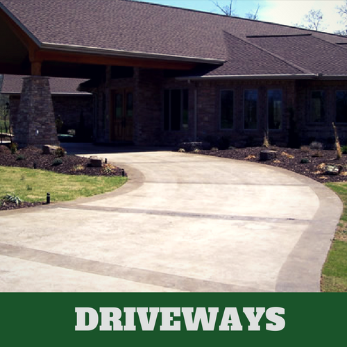 Two toned colored concrete driveway in Danbury, CT with brick home.