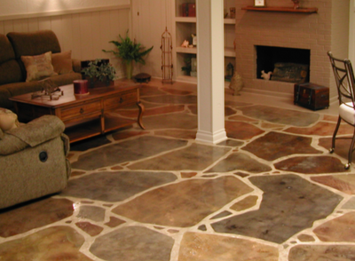 Decorative concrete basement floor with a multi-colored stone pattern.