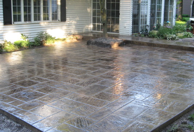 Dark brown polished stamped concrete patio.