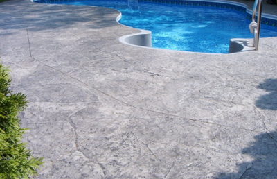 Texturized gray pool deck in Danbury.