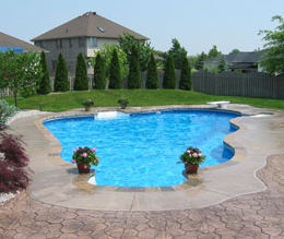 Stamped and stained concrete around a built in pool in Connecticut.