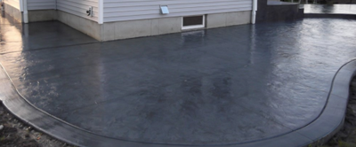 Stained and polished gray concrete patio.