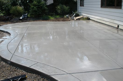 Polished plain concrete with a textured stamped concrete edging.